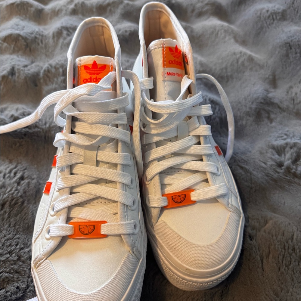 Converse White Sneakers with Orange Graphic